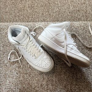 Nike White Athletic Sneakers with Black Swoosh